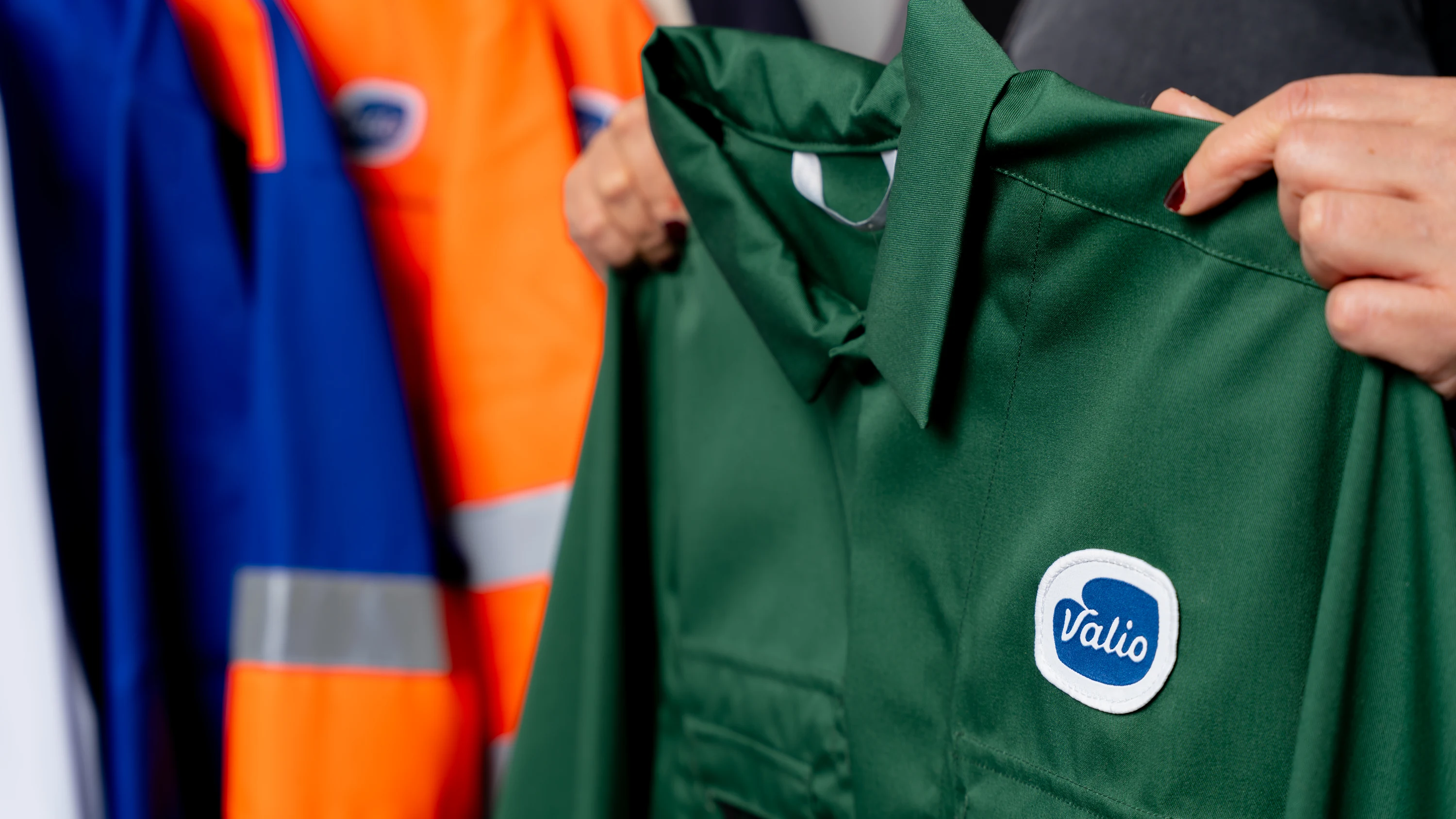 A work jacket with the customer logo among other workwear
